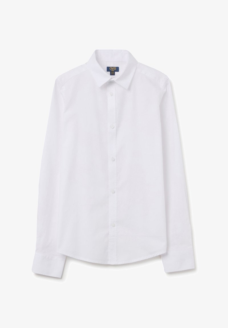 Chemise blanche à manches longues avec col classique, fermeture à boutons et manches à poignet. Fabriquée dans un tissu lisse avec un design épuré et minimal.