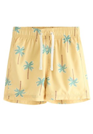 Gule badeshorts med blågrønne palmeprint og hvid snøre i den elastiske linning.