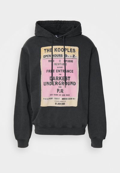 Black hoodie featuring a graphic print with yellow and pink text. Adjustable drawstring hood and ribbed cuffs and hem. Soft fabric texture.