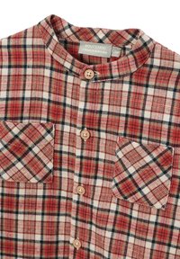 Chemise à carreaux rouge et blanc avec col mandarin, dotée de boutons en bois, de deux poches poitrine et d'un tissu doux au toucher.