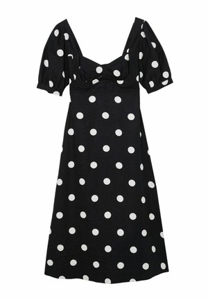 Vestito midi nero con pois bianchi, maniche corte a sbuffo e scollo a cuore.