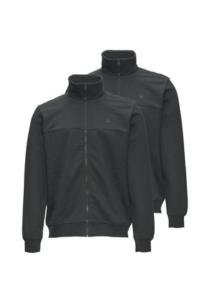 Deux vestes noires zippées avec cols montants et poignets côtelés, présentées sur fond blanc.