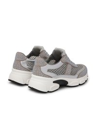 Gray and white sneakers with mesh fabric, textured accents, rhinestone detailing, and thick white soles. Closed design with laces.