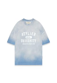 Light blue tie-dye t-shirt, short sleeves, features white text: "ATELIER 2018 RETERNITY CREATIVE DIRECTOR." Cotton material, relaxed fit.