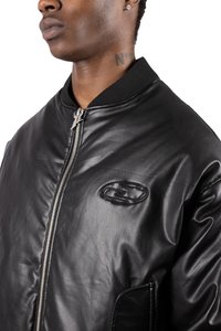 Black leather bomber jacket with a ribbed collar, zip closure, and an embroidered logo on the chest. Features a smooth, glossy texture.