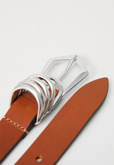 Brown leather belt with a silver metal buckle, featuring a geometric design and multiple circular accents near the buckle. Textured surface.