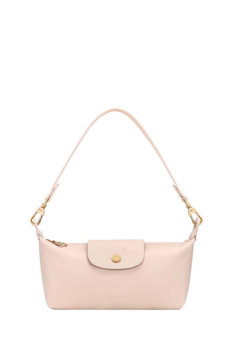Small pale pink leather handbag with single strap, flap closure, gold button, and gold hardware on white background.