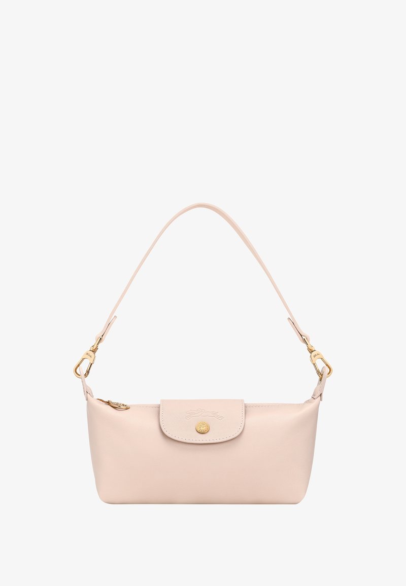 Small pale pink leather handbag with single strap, flap closure, gold button, and gold hardware on white background.