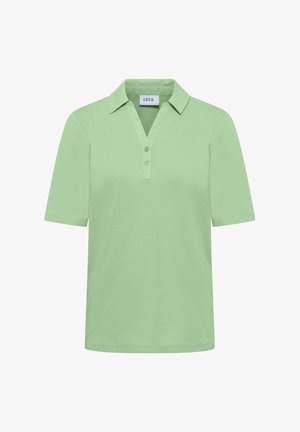 Polo manches courtes vert clair avec col et deux boutons, étiqueté "CECIL" à l'intérieur du col.