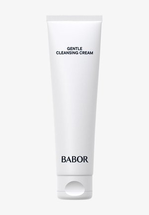 Tube blanche de crème nettoyante avec un capuchon à rabat, étiquetée "Crème Nettoyante Douce" en texte noir en gras, de la marque BABOR.