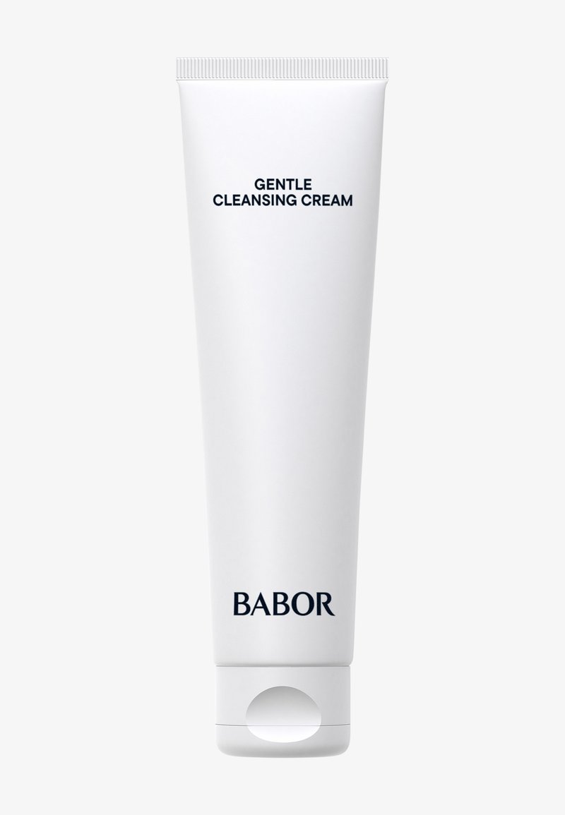 Tube blanche de crème nettoyante avec un capuchon à rabat, étiquetée "Crème Nettoyante Douce" en texte noir en gras, de la marque BABOR.