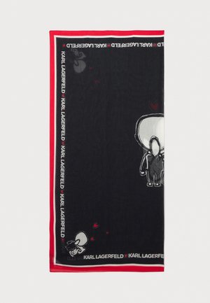 Mustasaalilla varustettu huivi, jossa on valkoisia ja punaisia graafisia kuvioita, mukaan lukien hahmoja ja sydämiä. Reunoilla on kontrastivärinen punainen reunus, jossa on tekstiä.