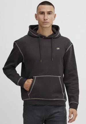 Dark gray hoodie featuring a kangaroo pocket, contrasting stitching, and an adjustable drawstring hood. Made from soft, textured fabric.