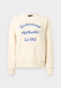 Sweatshirt crem cu text albastru "Timberland Authentic Est 1973". Are guler rotund și manșete rib etapa. Textura moale a materialului, design casual.