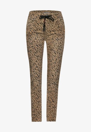 Pantalones ajustados beige con rayas abstractas de tigre negras y cordón negro en la cintura, con bolsillos delanteros y traseros.