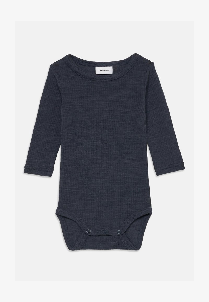 Dlhý rukáv tmavosivý body vyrobený z textúrovanej látky, s okrúhlym výstrihom a zapínaním na patentky v spodnej časti.