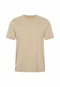 Béžna bombažna majica kratkih rokavov z okroglim izrezom, prikazana položena na ravni površini na belem ozadju.