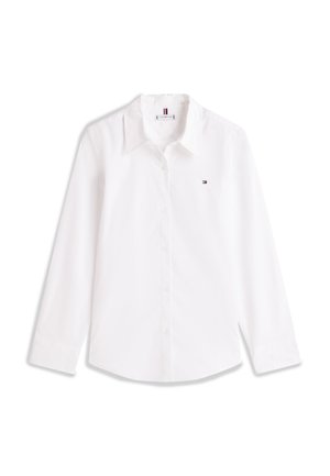 White long-sleeve button-up shirt with pointed collar and small Tommy Hilfiger logo on the left chest.
