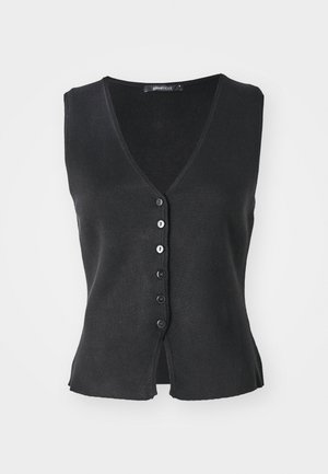 Melnas bez piedurknēm kardigāns, izgatavots no diega auduma, ar V veida kaklu, sešiem priekšējiem pogām un šķirtu apakšdaļu.