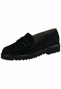 Mocasín de ante negro con un diseño de perfil bajo, superficie texturizada y acentos de tachuelas a lo largo de la correa. Suela gruesa y resistente de color negro.