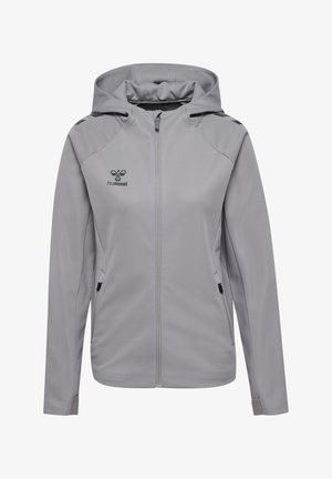 Veste à zip grise avec capuche, présentant une texture lisse, deux poches latérales et des accents noirs sur les épaules et la capuche. Logo Hummel sur la poitrine.