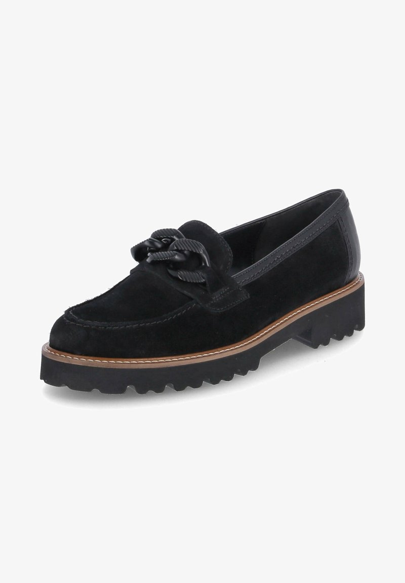 Mocassins en daim noir à bout arrondi, avec un détail noué sur le dessus et une semelle en caoutchouc épaisse et texturée avec un motif en zigzag.