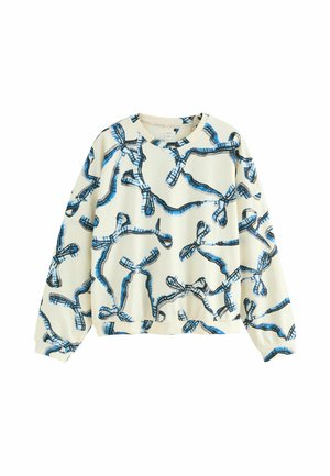Krämfärgad sweatshirt med ett blått och svart ripsmönster, med långa ärmar, rund halsringning och avslappnad passform. Mjuk, texturerad tyg.