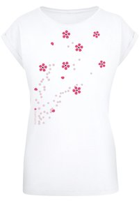 White short-sleeve t-shirt featuring a pink and light pink floral pattern with scattered petals. Soft cotton fabric, relaxed fit.