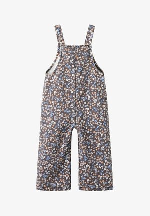 Smeđe široke kombinezonske hlače s plavim, bijelim i bež cvjetnim uzorkom te naramenicama.