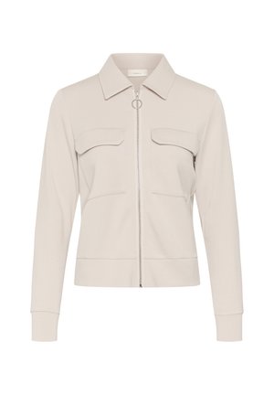 Bézs színű, hosszú ujjú dzseki gallérral, elöl cipzárral és két zsebfedős mellzsebbel, testre szabott szabás és minimális dizájn.