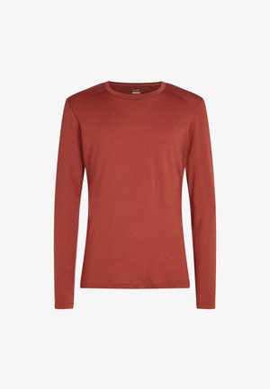 Langærmet crew neck skjorte i en brændt orange farve, lavet af et tekstureret stof med en glat overflade og ingen synlige mønstre eller accenter.