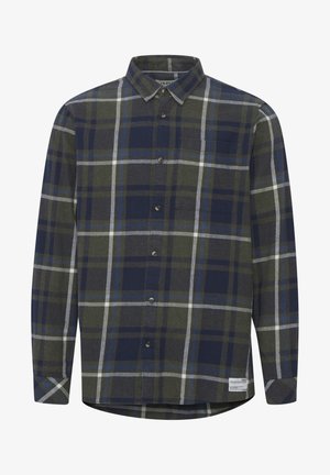 Tumedast rohelisest, meresinist ja hallist ruudulisest flanellist särk pikkade varrukatega. Omab nööpidega esiosa, kraed ja vasakul rinnal taskut.