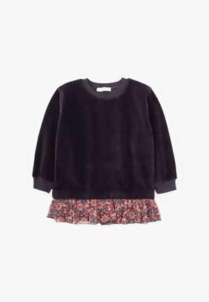 Tumšas violetas krāsas krekls ar garām piedurknēm, ar ribinātu apkakli un piedurknēm, kam pie kakla ir kārtojuma ziedu raksts rozā un tumši zilos toņos, kas rotā apakšmalu.