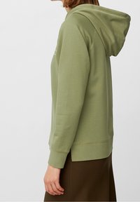 Olijfgroene hoodie met lange mouwen, ribgebreide manchetten en een kangoeroezak. Glad katoenmix-stof met een ontspannen pasvorm.