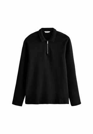 Czarny długi sweter z dzianiny z długim rękawem, kołnierzem i krótkim srebrnym zamkiem błyskawicznym z przodu na środku.