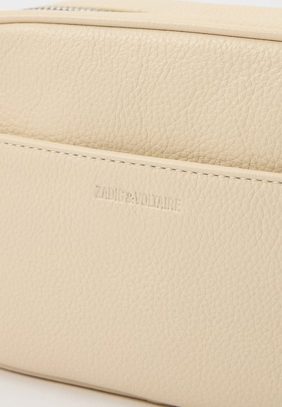 Cream leather pouch featuring a textured surface, embossed brand logo, and a zipper closure. Simple rectangular shape with clean lines.