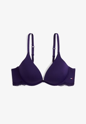 Sostén acolchado morado con tirantes ajustables, ribete de encaje en la banda y un pequeño logo bordado en el lateral.