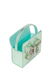 Borsa a tracolla in pelle verde menta con una finitura lucida, dotata di un fiocco decorativo con accenti metallici e un interno liscio.