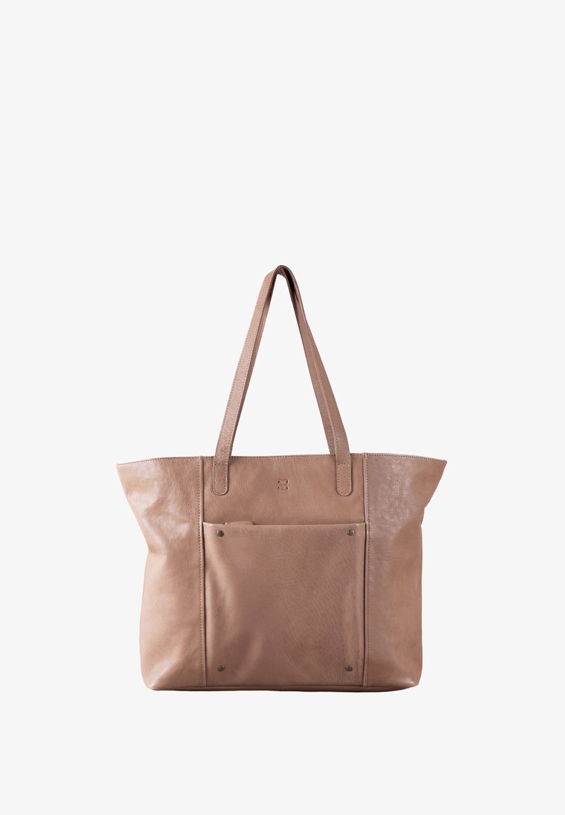 Leather tote bag in a soft beige color, featuring smooth texture, long handles, and a front pocket with metal studs.