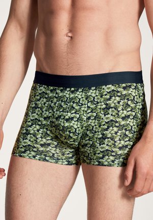 Blumenmuster-Boxershorts in Grüntönen auf einem dunklen Hintergrund, mit einem dunklen elastischen Bund. Weicher Stoff, enge Passform.