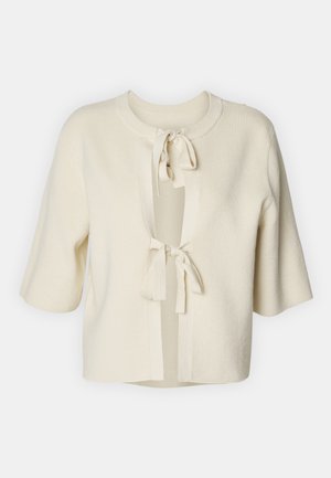 Korte mouwen, open cardigan van zachte, crèmekleurige stof met een ribbelstructuur en twee striksluitingen bij de hals.