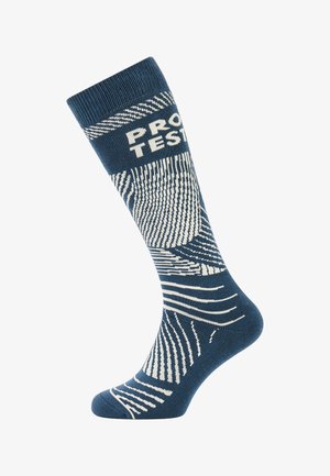 Blauw en wit gemêleerd kniekous, gemaakt van breimateriaal, met diagonale en golvende lijnen, voorzien van de tekst "PRO" nabij de bovenkant.