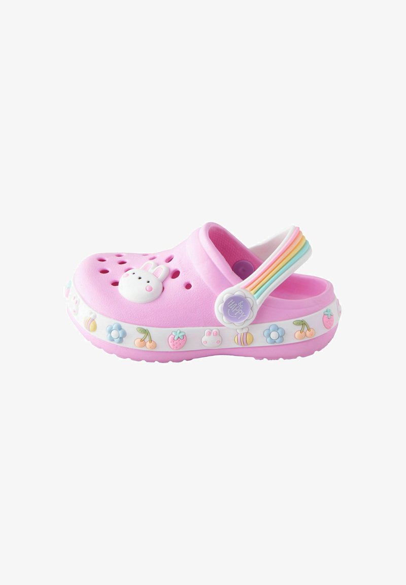 Pink clogs with a bunny design, featuring a patterned white band with colorful fruits and flowers. Includes a rainbow heel strap.