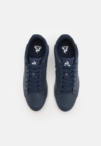 coq sportif la petite robe noire