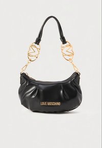 Black Love Moschino shoulder bag with gold-tone heart-shaped metal attachments on the strap and zipper closure on top.