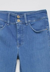 Blue denim jeans with double button closure, front pockets, and belt loops, shown from the waist to mid-thigh on a plain background.