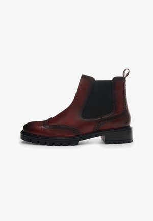 Dark red leather Chelsea boot with brogue detailing, black elastic side panel, lug sole, and pull tab at the heel.