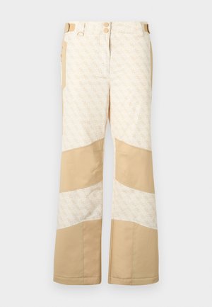 Beige hó/nadrág, mintás anyaggal és egyszínű kiegészítőkkel. Két gombbal, több zsebbel és széles lábakkal rendelkezik. Texturált felület.