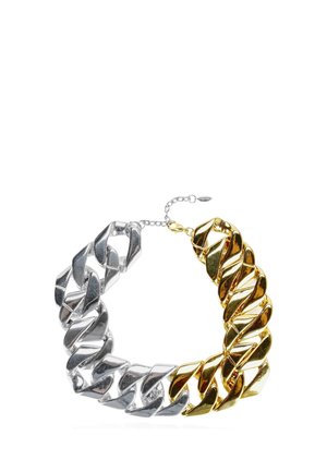 Chunky chain necklace with large interlocking links, half silver and half gold, featuring a small adjustable clasp chain.