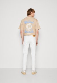 Jack & Jones JJIGLENN JJORIGINAL - Vaqueros slim fit - white denim